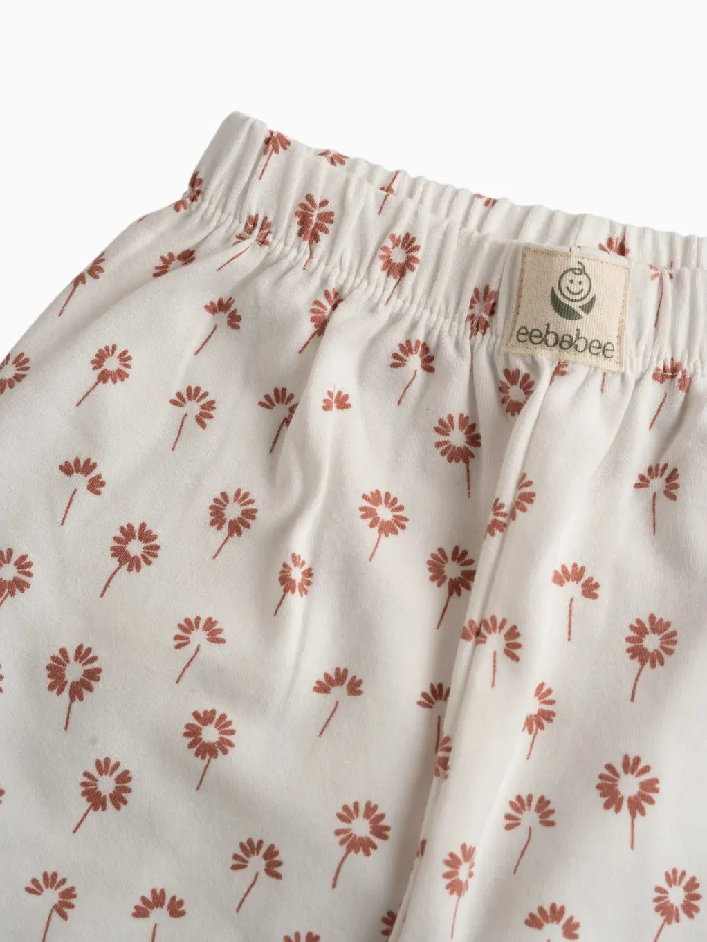 Brown flower pattern in white leggings for baby girl